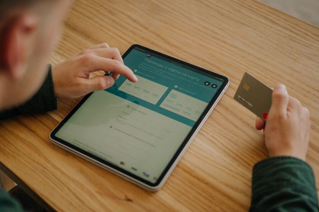 Person reviewing bank and credit card statements each month.
