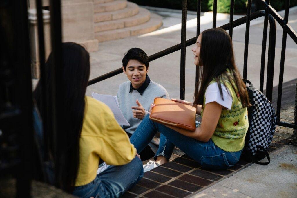 Student talking with a classmate about course tips